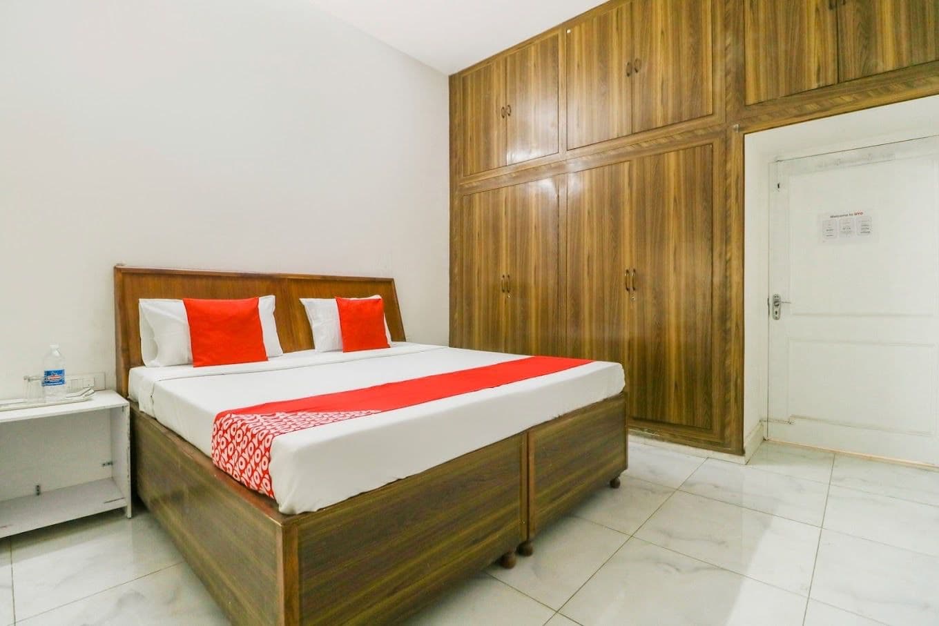 Spacious air-conditioned guest room with king bed at Hotel Amar, Patiala
